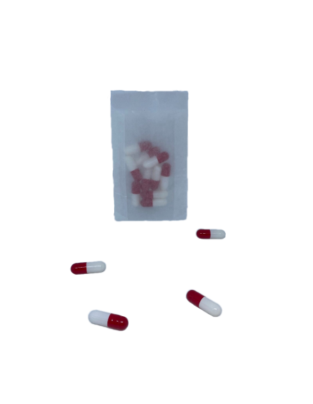 sachet plastique contenant des gélules vides rouge et blanc